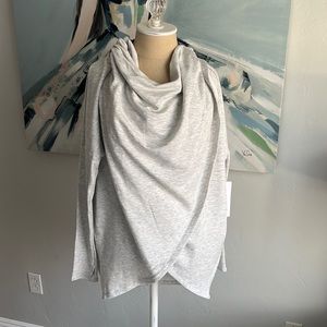 New without tags. Grey Purana Wrap sweatshirt Worn only once. Fits like a Large.